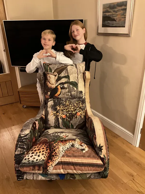 Our beautiful grandchildren with our beautiful chair!